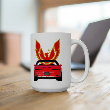 1988 GTA Trans AM 15oz ceramic mug on wooden table, featuring bold red and orange car graphic.
