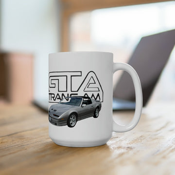 1989 Trans AM GTA 15oz ceramic mug on a wooden table, featuring vintage car graphic.