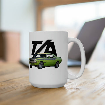 1970 Challenger TA T-Bird 15oz Ceramic Mug with green car graphic on table.